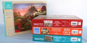 4 jigsaw puzzles in boxes,
