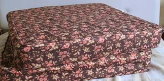 A brown mattress with flower pattern.