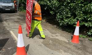 Signs and barriers being removed at West Chiltington Road