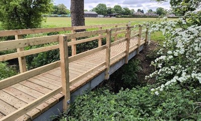 Photo of new wooden bridge on countryside walking route