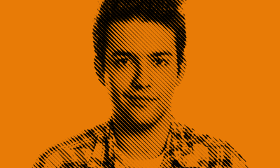 Young man with a shy smile