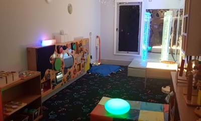 Toys, lights and floor matt facilities in the sensory room