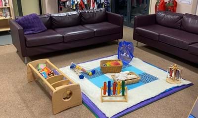 Social area including toys and sofas