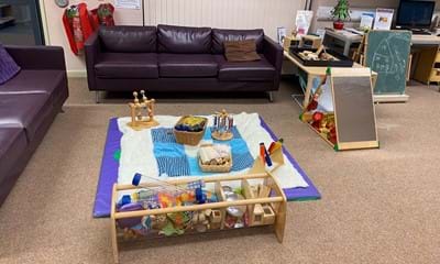 Social area facilities including table of toys