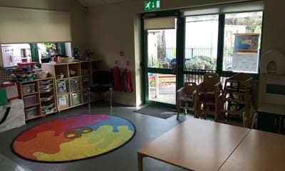 Play room facilities including table and play mat