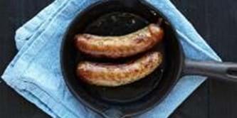Two sausages in a frying pan