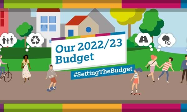 Drawn street scene with the words 'Our 2022/23 budget #westsussexbudget'