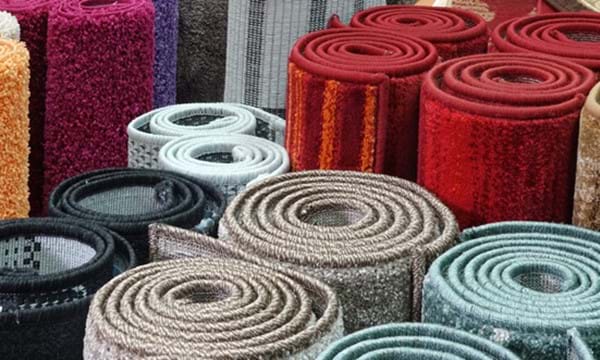 Several rolled up carpets.