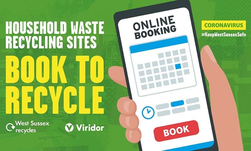 Hand holding phone to book to recycle