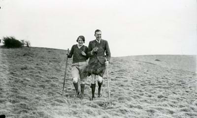 Man and woman walking on the South Downs in 1933