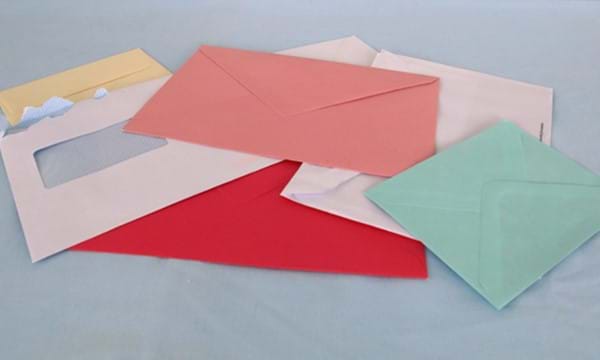 A number of different coloured envelopes.