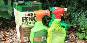 Garden chemicals in cans and spray bottles.