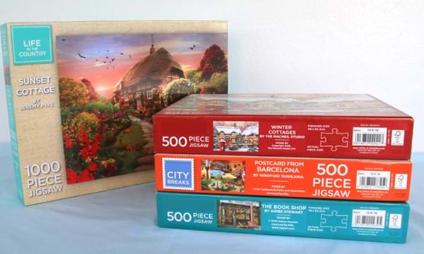 4 jigsaw puzzles in boxes,