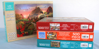 4 jigsaw puzzles in boxes,