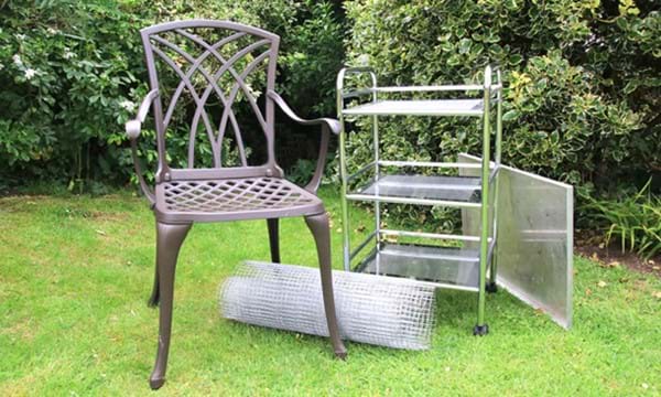A metal chair, some wire, a metal trolley and a metal tray.