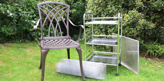 A metal chair, some wire, a metal trolley and a metal tray.