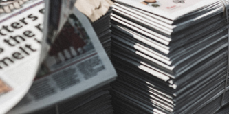 2 stacks of newspapers.