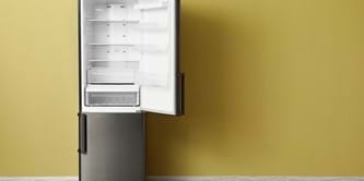 A fridge freezer with the fridge door open.
