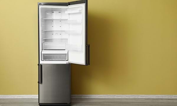 A fridge freezer with the fridge door open.