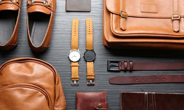 Various leather articles, including a belt, wallet, bags and watch straps.