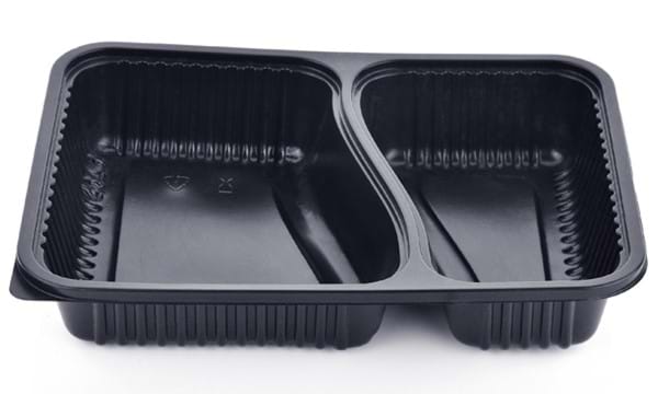 A black plastic convenience meal tray. 