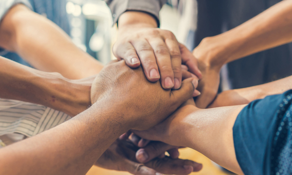 Group of people holding hands