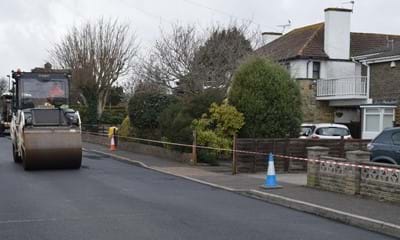 A large area of road being resurfaced – part of West Sussex Highways’ pothole prevention strategy