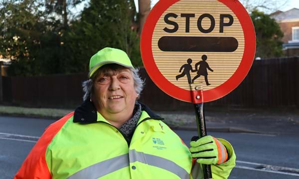 School Crossing Patrol Jane Hooper with the same crossing pole she has used throughout her 25 years’ service