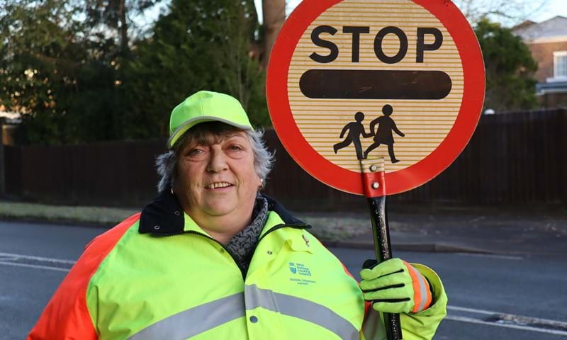 School Crossing Patrol Jane Hooper with the same crossing pole she has used throughout her 25 years’ service