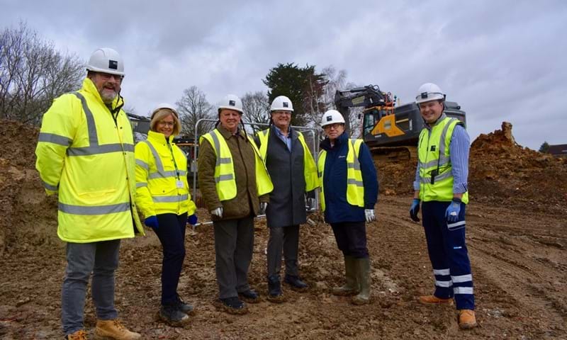 Council leaders visiting the construction site to rebuild Woodlands Meed College in Burgess Hill