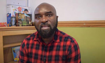 Albert, wearing a plaid shirt