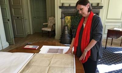 Wendy Walker, County Archivist at West Sussex Record Office looking at the Sussex Declaration