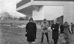Miss Muriel Smith visits the site of Chichester Festival Theatre whilst under construction. Also present is the Mayor, Leslie Evershed-Martin and others. Outside the surroundings are unlandscaped, 16th Feb 1962. Chichester Photographic Collection West Sussex Record Office Ref No: CPS 1067/4.