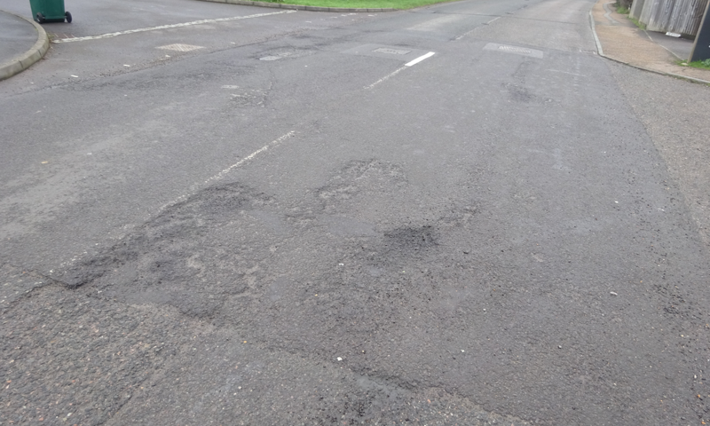 The current surface on the B2133 Vicarage Hill, Loxwood 