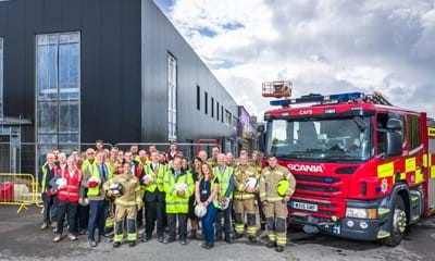 Group photo outside the new Horsham Fire Station with representatives from West Sussex County Council, West Sussex Fire and Rescue Service and Willmott Dixon.