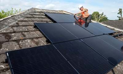 Man on roof fitting solar