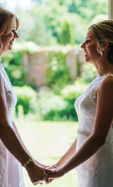 Two women in bridal dresses.