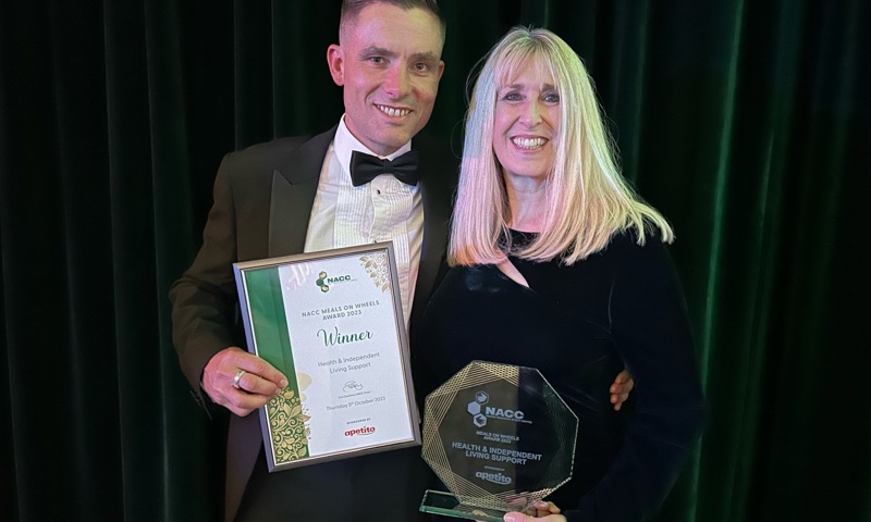 John Figgins from West Sussex County Council stands next to Sarah Wren from Health & Independent Living Support as they both hold their award from the National Association of Care Catering.