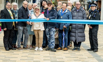 Ribbon-cutting celebration time: With the giant scissors, Cllr Steve Waight, West Sussex County Council Cabinet Member for Support Services and Economic Development, Cllr Alison Cooper, Arun District Council Chair, and Cllr Sean Lee, The Deputy Mayor of Littlehampton, with other dignitaries and guests