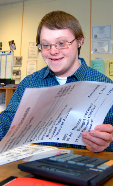 Disabled young person with paperwork.