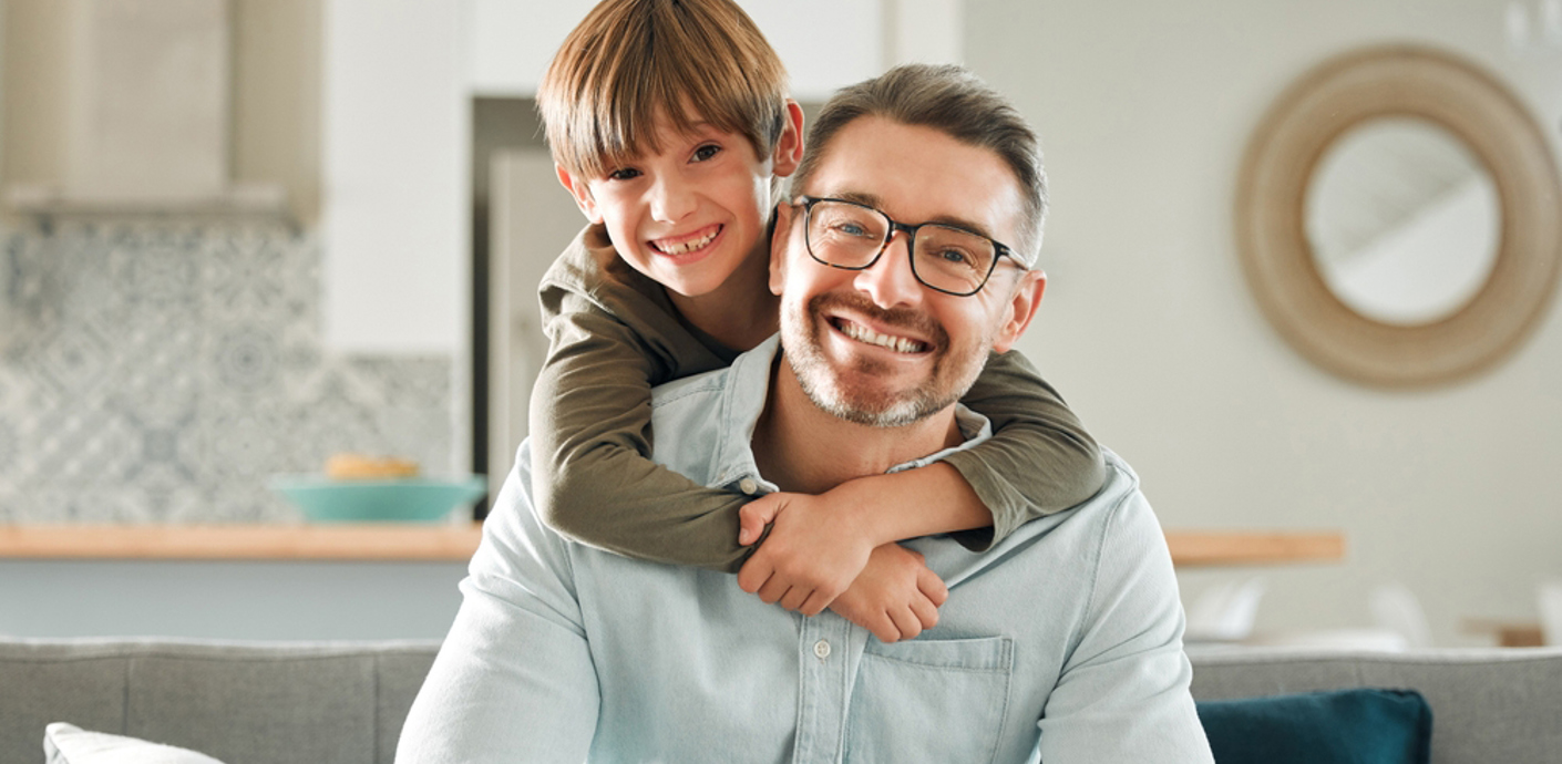 Son hugging his father