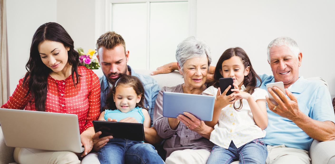 nojs A family group of all ages sitting together using various digital devices