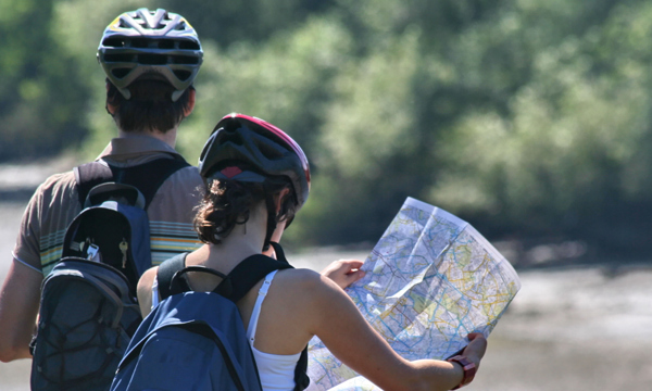 Cyclists using a map