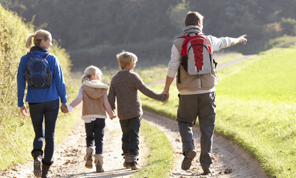 Family walking down a country lane