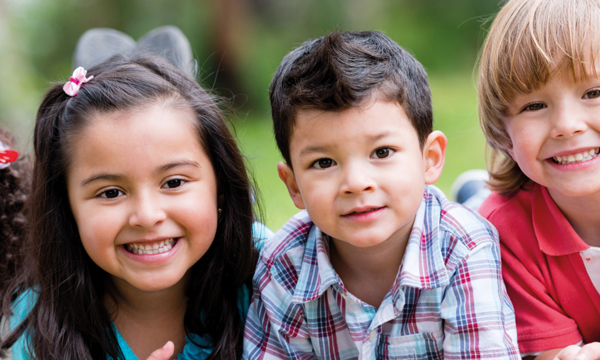 Four grinning children