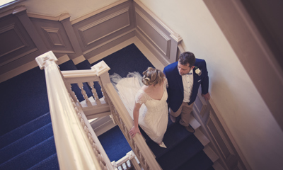Bride and groom on staircase