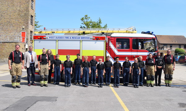 EVOLVE students standing in front of a fire engine