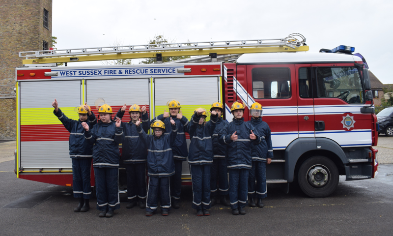 BLAZE students standing in front of a fire engine