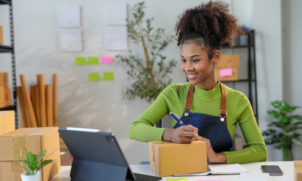 A lady looking at an ipad