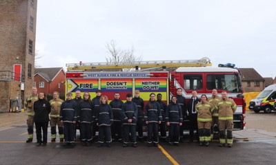 IGNITE students standing in front of a fire engine